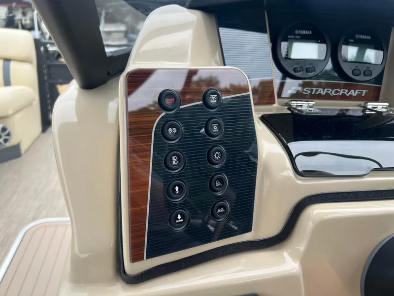 Slide: The Image of Control panel of 2025 Starcraft RX 23 R DC boat with various buttons and gauges. - 8
