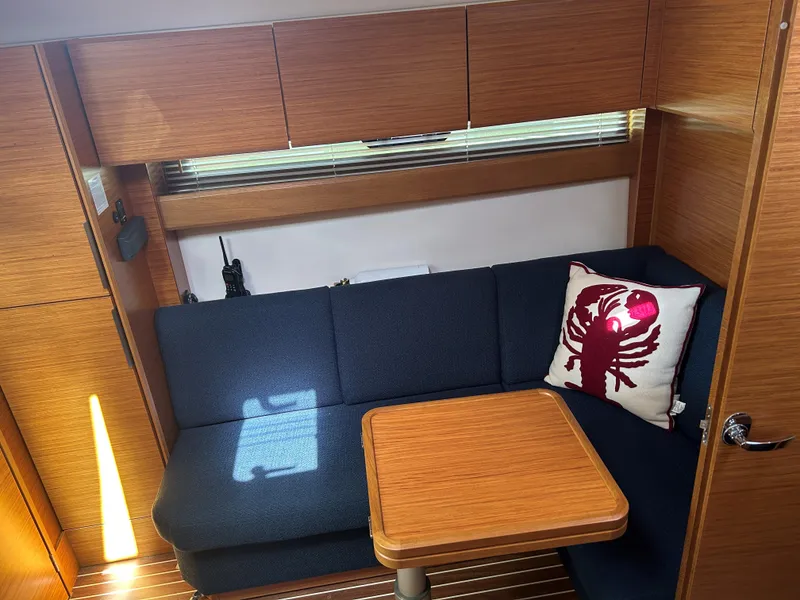 Slide: The Image of Interior of 2017 Bavaria S36 Coupe with blue seating and wooden table. - 18