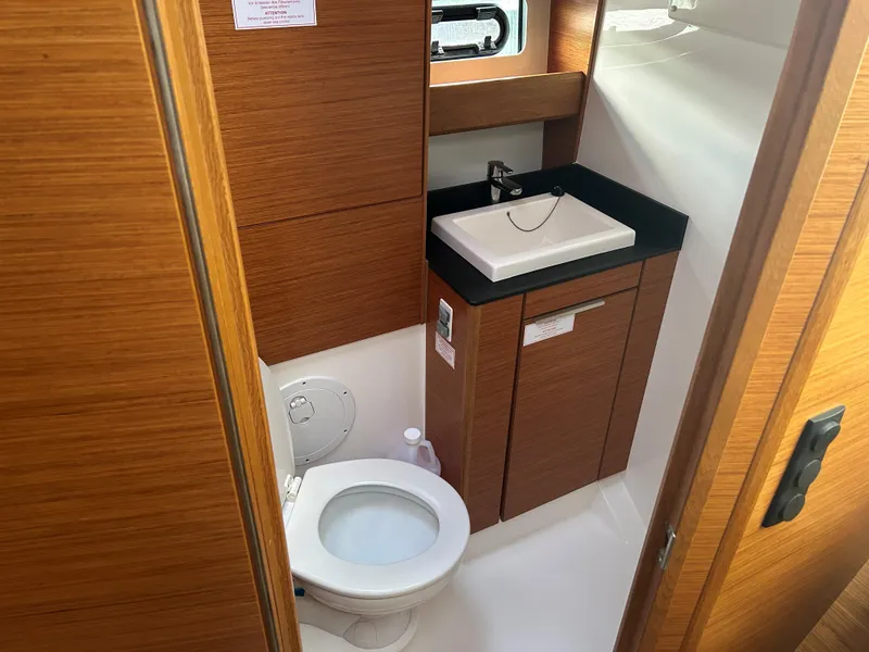 Slide: The Image of Bathroom interior of 2017 Bavaria S36 Coupe with wooden cabinetry and modern fixtures. - 19