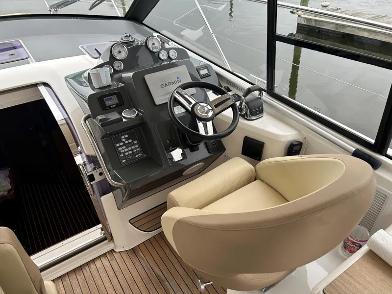 Slide: The Image of Helm of 2017 Bavaria S36 Coupe with modern controls and beige seating. - 7