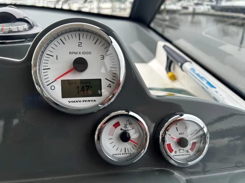 Slide: The Image of Dashboard of 2017 Bavaria S36 Coupe showing RPM, engine hours, and voltage gauges. - 8
