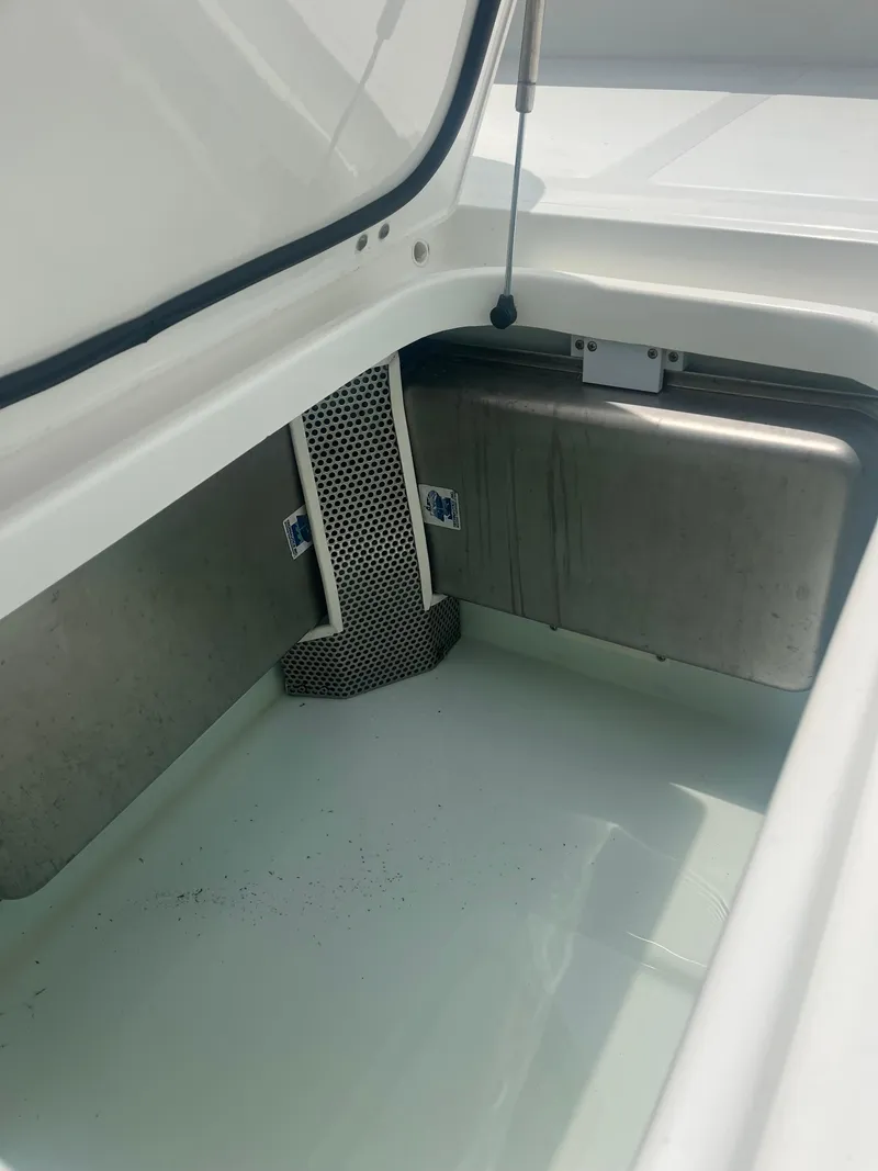Slide: The Image of 2016 Venture 39 Forward Seating boat storage compartment with open lid. - 12