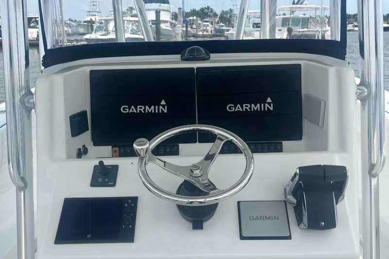 Slide: The Image of 2016 Venture 39 Forward Seating boat dashboard with Garmin navigation displays. - 3