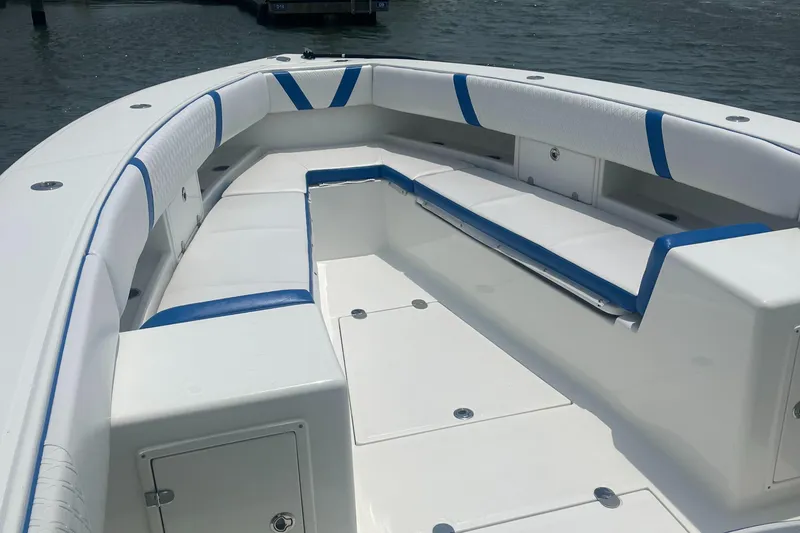 Slide: The Image of 2016 Venture 39 Forward Seating boat with white and blue cushioned seats. - 4