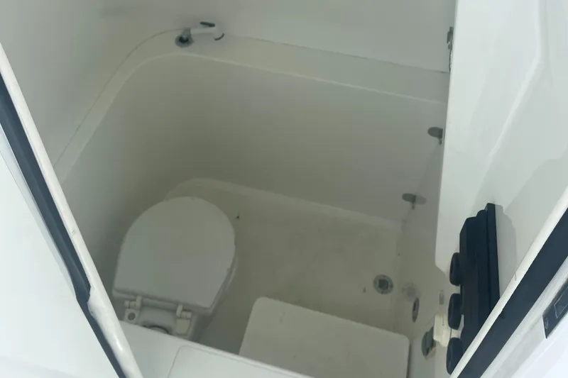 Slide: The Image of 2016 Venture 39 Forward Seating boat interior with compact marine toilet. - 7
