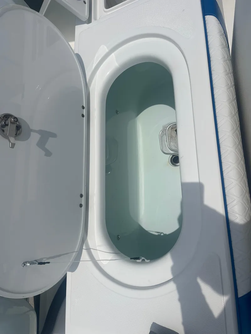 Slide: The Image of 2016 Venture 39 Forward Seating boat with open storage compartment. - 8