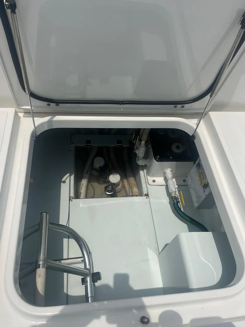 Slide: The Image of 2016 Venture 39 Forward Seating boat storage compartment with open hatch. - 9