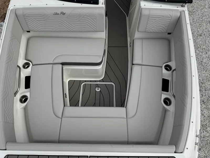 Slide: The Image of 2025 Sea Ray SDX 270 Surf boat interior with spacious seating and cup holders. - 12