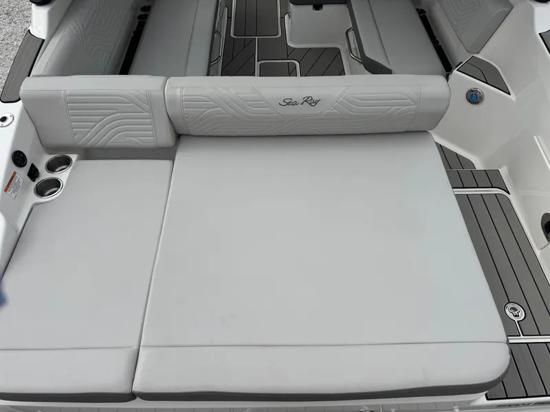Slide: The Image of 2025 Sea Ray SDX 270 Surf boat with spacious seating and sleek design. - 4