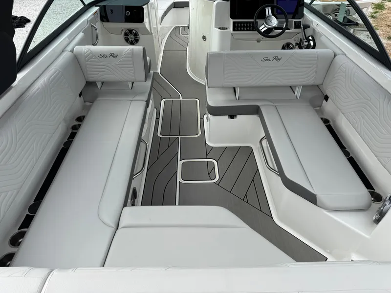 Slide: The Image of 2025 Sea Ray SDX 270 Surf boat interior with sleek seating and modern dashboard design. - 5