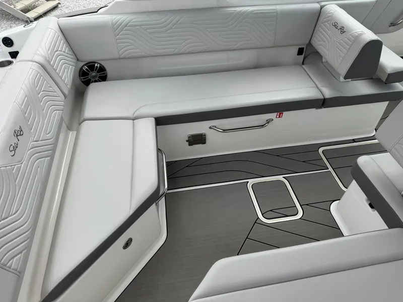 Slide: The Image of 2025 Sea Ray SDX 270 Surf boat interior with sleek seating and modern design. - 6