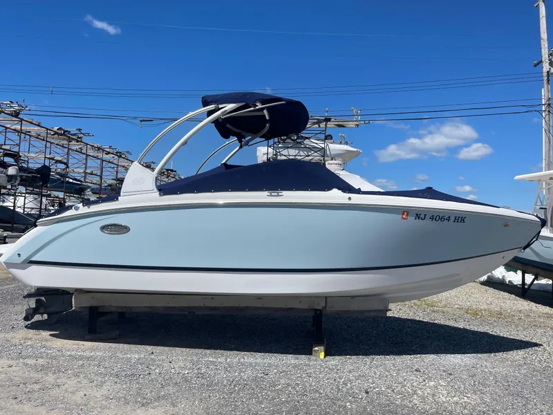 Slide: The Image of 2016 Cobalt R5 boat on display under a clear blue sky. - 1