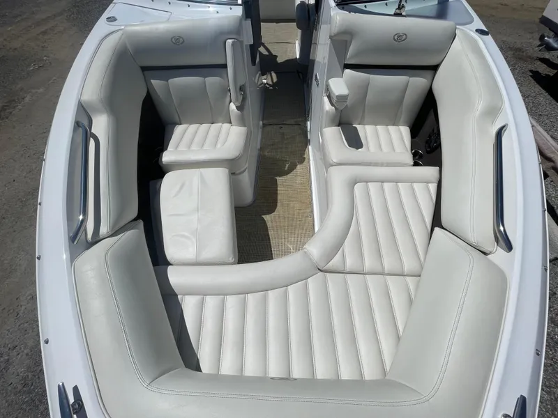 Slide: The Image of 2016 Cobalt R5 boat interior with white leather seating and modern design. - 15