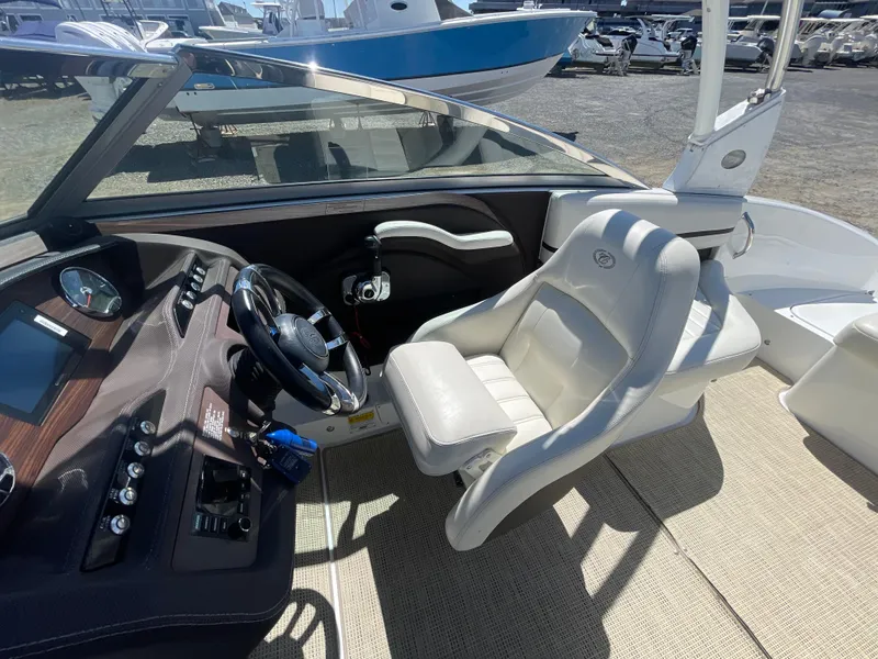 Slide: The Image of 2016 Cobalt R5 boat interior with steering wheel and comfortable seating. - 17