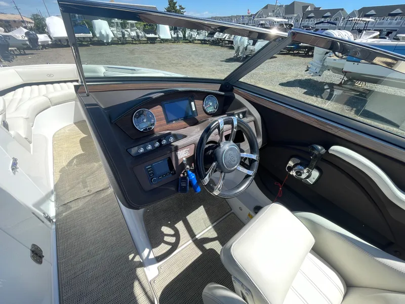 Slide: The Image of 2016 Cobalt R5 boat interior with steering wheel and dashboard controls. - 18
