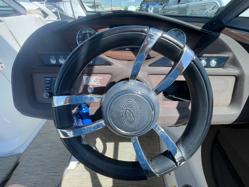 Slide: The Image of Steering wheel of a 2016 Cobalt R5 boat, featuring a sleek design and modern dashboard. - 19
