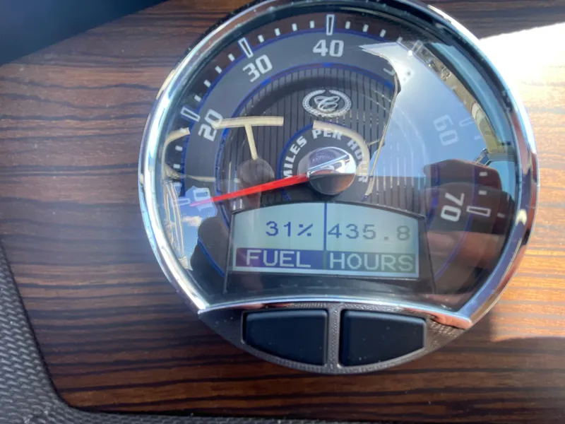 Slide: The Image of Gauge display of a 2016 Cobalt R5 showing fuel level and engine hours. - 24