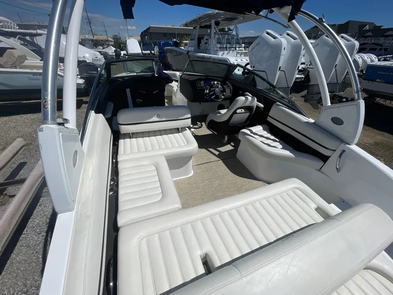 Slide: The Image of 2016 Cobalt R5 boat interior with white seating and modern dashboard. - 30