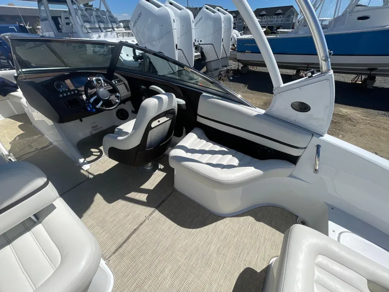 Slide: The Image of 2016 Cobalt R5 boat interior with white seating and modern dashboard. - 31