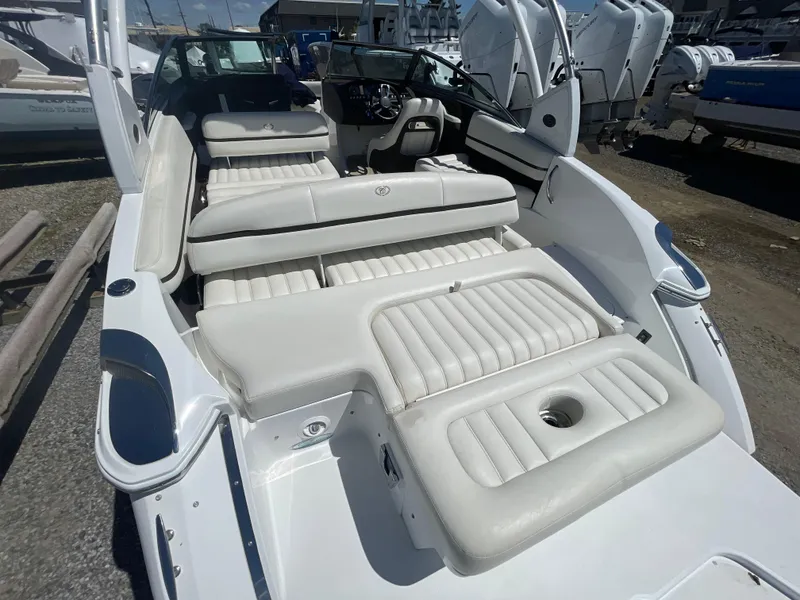 Slide: The Image of 2016 Cobalt R5 boat with white leather seating, docked outdoors. - 35