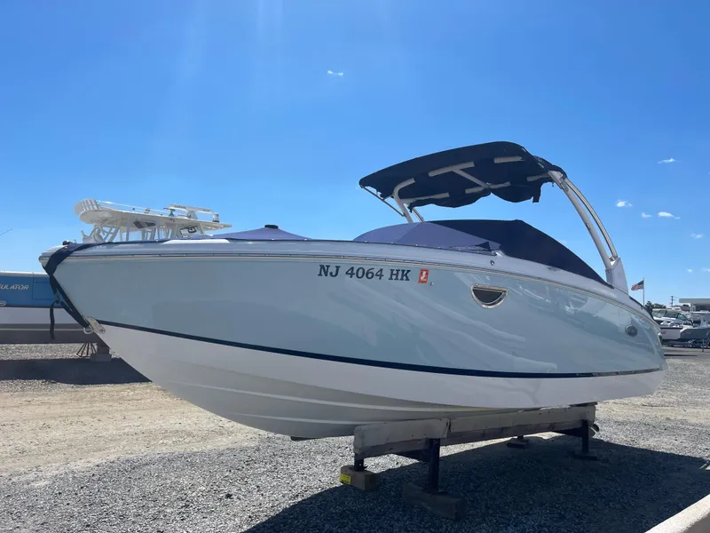 Slide: The Image of 2016 Cobalt R5 boat on display under clear blue sky. - 4