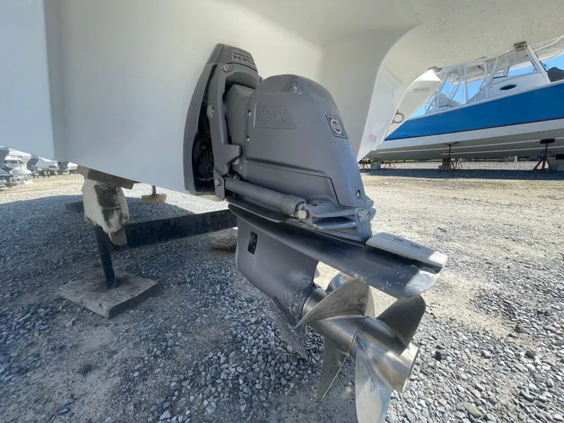 Slide: The Image of 2016 Cobalt R5 boat propeller and outdrive on gravel surface. - 41