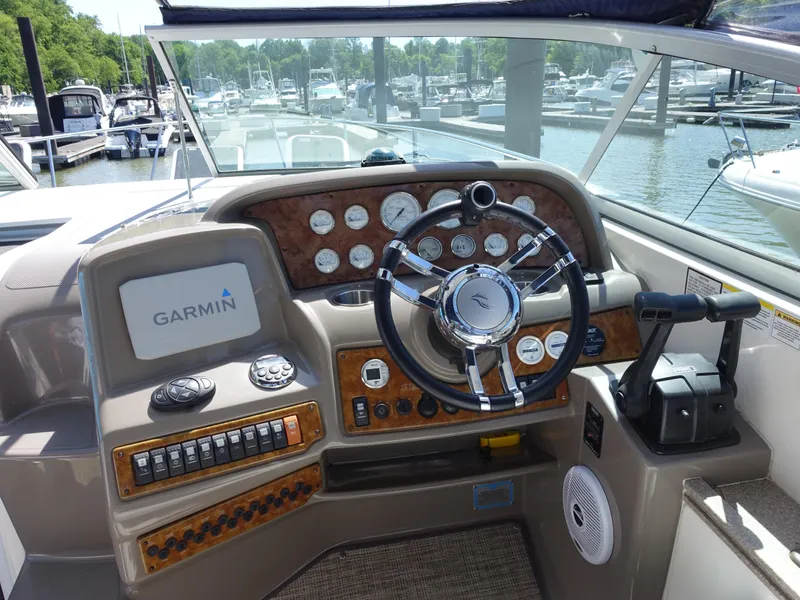 Slide: The Image of Helm of 2008 Rinker 330 Express Cruiser with Garmin navigation system at marina. - 16