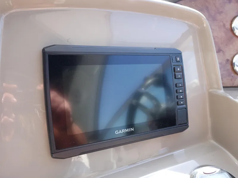 Slide: The Image of Garmin navigation system on 2008 Rinker 330 Express Cruiser dashboard. - 18