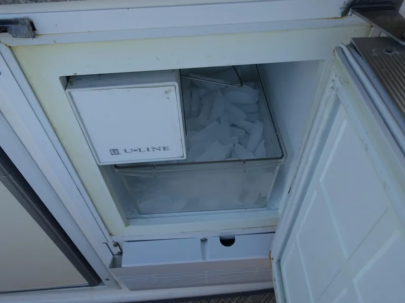 Slide: The Image of Ice maker on 2008 Rinker 330 Express Cruiser, featuring U-Line appliance. - 23