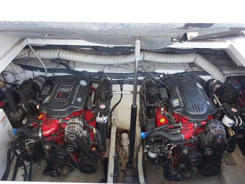 Slide: The Image of Engine compartment of a 2008 Rinker 330 Express Cruiser with dual inboard motors. - 25