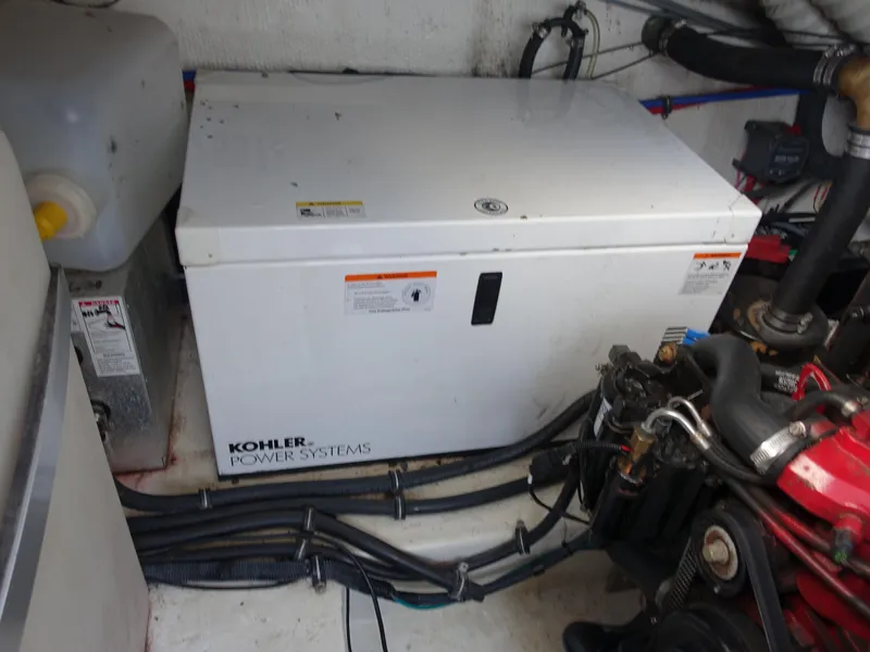 Slide: The Image of Engine room of 2008 Rinker 330 Express Cruiser with Kohler power system. - 28