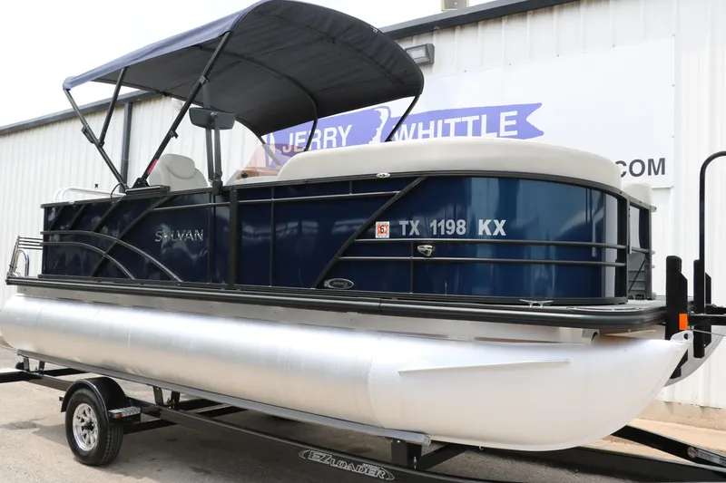 Slide: The Image of 2023 Sylvan Mirage Fish 820 Party Fish pontoon boat on trailer. - 11