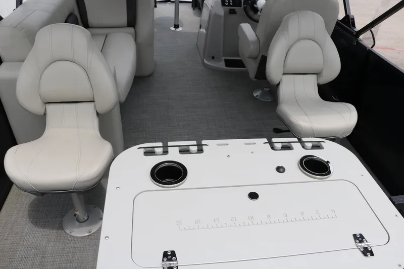 Slide: The Image of 2023 Sylvan Mirage Fish 820 Party Fish interior with seating and fishing table. - 18