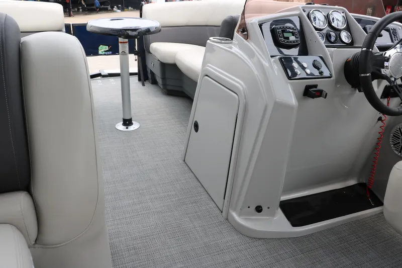 Slide: The Image of 2023 Sylvan Mirage Fish 820 Party Fish boat interior with seating and control panel. - 25