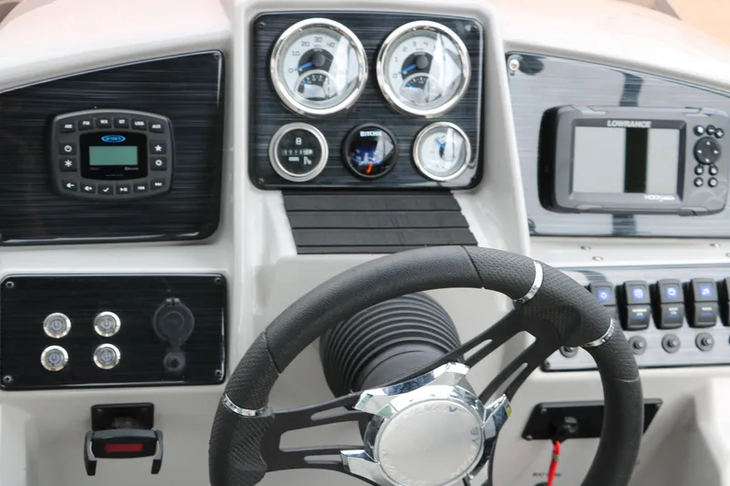 Slide: The Image of Dashboard of 2023 Sylvan Mirage Fish 820 Party Fish boat with steering wheel and gauges. - 26