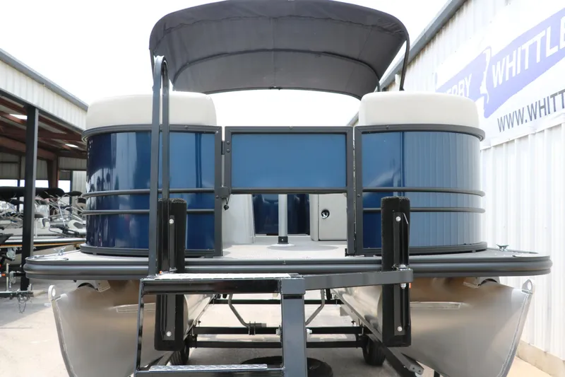 Slide: The Image of 2023 Sylvan Mirage Fish 820 Party Fish pontoon boat, blue exterior, docked at marina. - 8