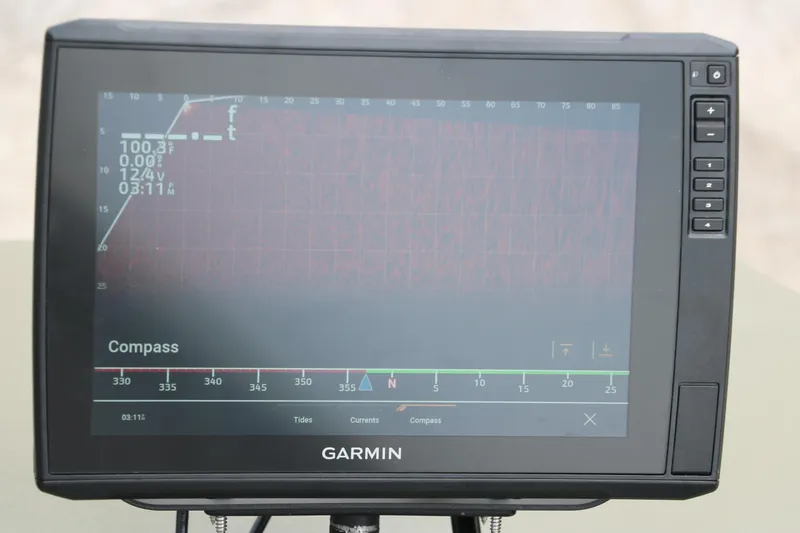 Slide: The Image of Garmin navigation display on 2024 Tracker Grizzly 2072 MVX boat, showing compass and data. - 16