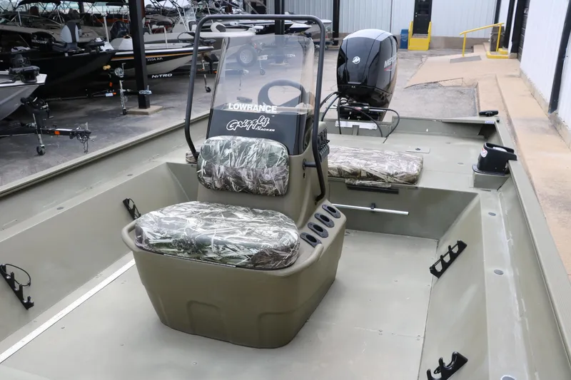 Slide: The Image of 2024 Tracker Grizzly 2072 MVX boat with camo seats and steering console. - 20