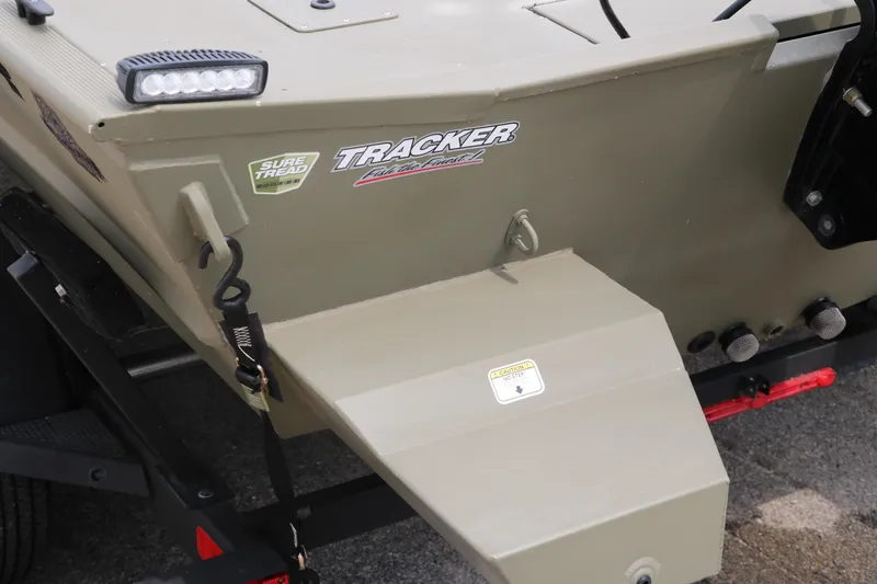 Slide: The Image of 2024 Tracker Grizzly 2072 MVX boat rear view with logo and trailer attachment. - 24