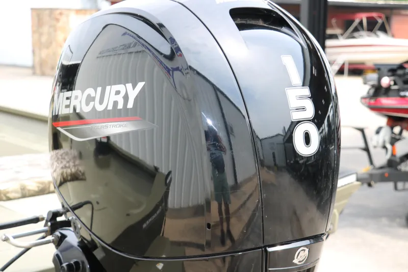 Slide: The Image of 2024 Tracker Grizzly 2072 MVX with Mercury 150 outboard engine, close-up view. - 25