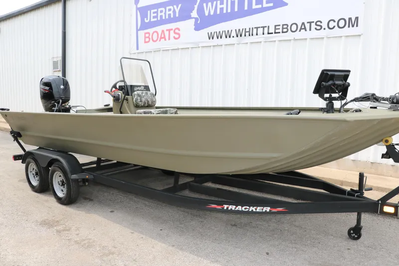 Slide: The Image of 2024 Tracker Grizzly 2072 MVX boat on trailer outside dealership. - 4