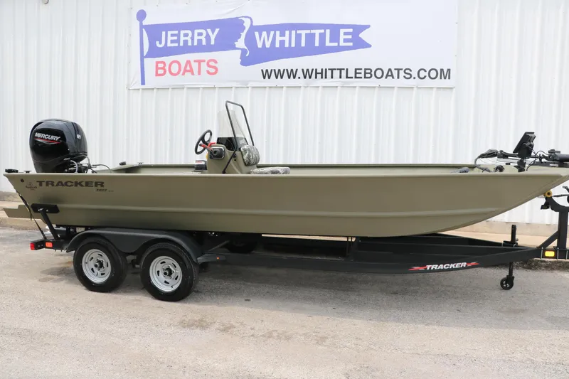 Slide: The Image of 2024 Tracker Grizzly 2072 MVX boat on trailer at Jerry Whittle Boats dealership. - 6