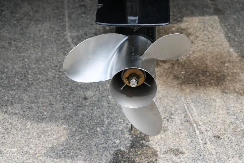 Slide: The Image of 2024 Tracker Grizzly 2072 MVX boat propeller on concrete surface. - 9