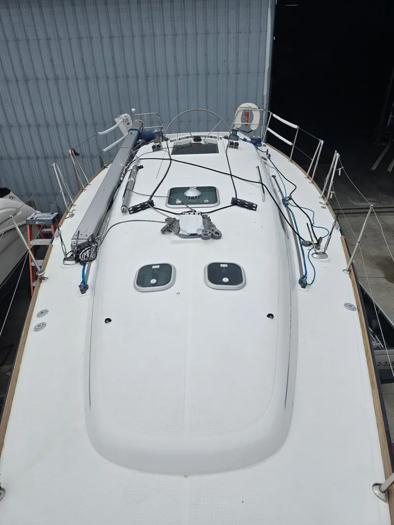 Slide: The Image of Beneteau First 40.7 sailboat deck, 2000 model, docked in a marina. - 10
