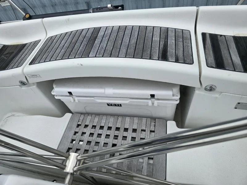 Slide: The Image of Beneteau First 40.7 yacht cockpit with wooden flooring and Yeti cooler, 2000 model. - 11