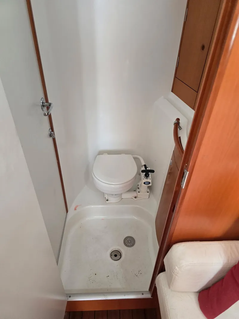 Slide: The Image of Compact bathroom in 2000 Beneteau First 40.7 sailboat with toilet and shower. - 15