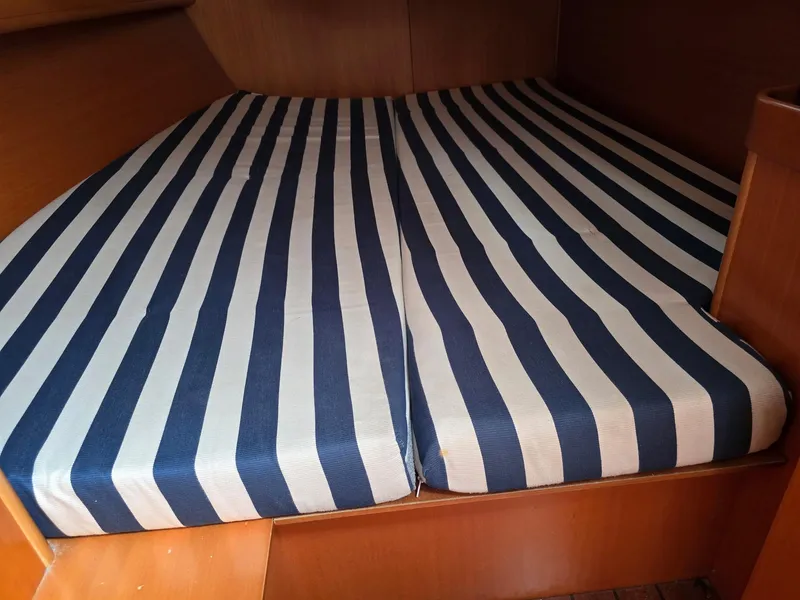 Slide: The Image of Striped mattress in the cabin of a 2000 Beneteau First 40.7 sailboat. - 17