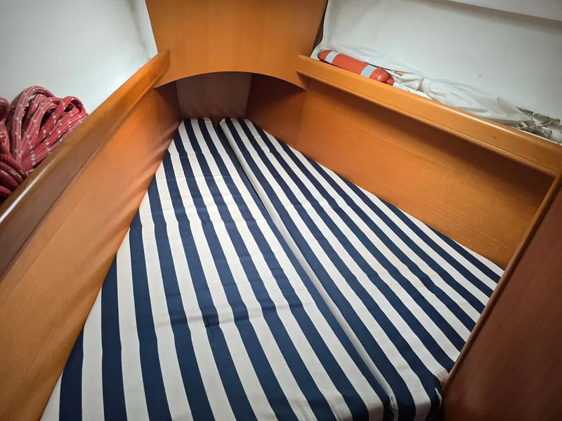 Slide: The Image of Beneteau First 40.7 cabin interior with striped bedding, 2000 model. - 23