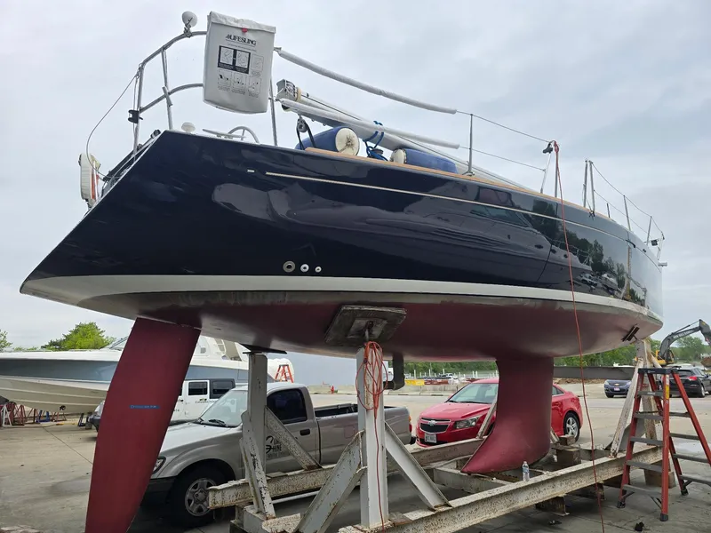 Slide: The Image of Beneteau First 40.7 sailboat from 2000 on a trailer, with visible keel and rudder. - 3