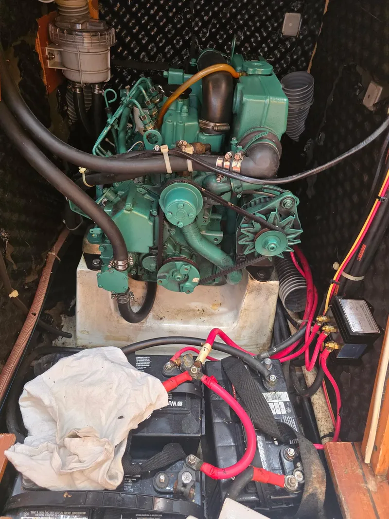 Slide: The Image of Engine compartment of a 2000 Beneteau First 40.7 sailboat, featuring wiring and components. - 33